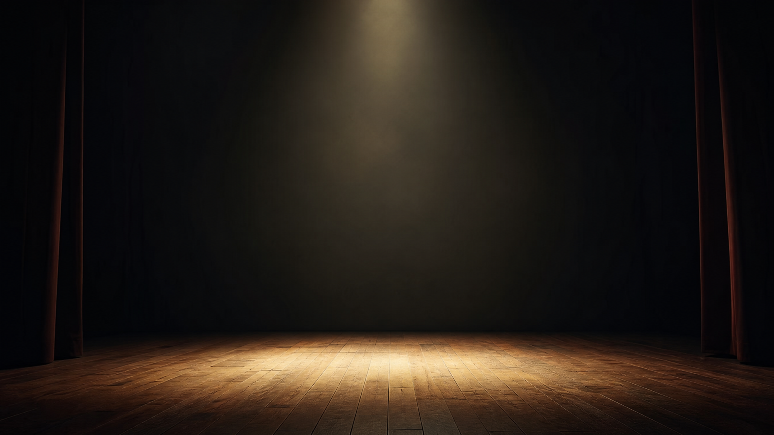 Escenario vacío iluminado para la colaboración de Maigualida Gamero sobre presencia y síndrome del impostor